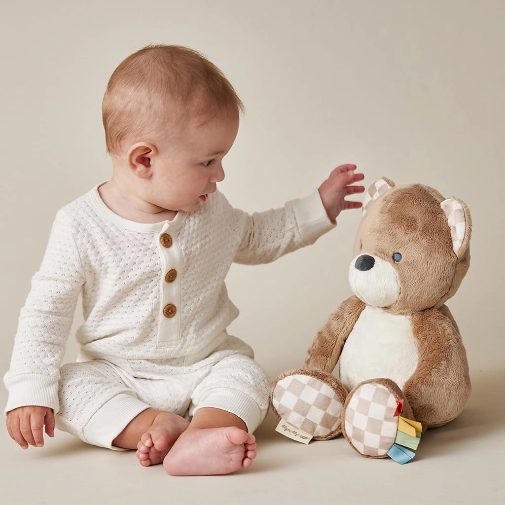 Itzy Ritzy Baby Plush Toy – Soft Stuffed Animal for Babies & Kids – Sensory Ribbons & Textured Fabrics for Tactile Play – Cozy & Cuddly Companion for Newborns & Up (Bear)